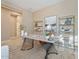 Well-lit home office offers a contemporary desk, built-in shelving, and serene view at 12820 W La Vina Dr, Sun City West, AZ 85375