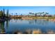 Scenic pond view overlooking the golf course and community homes at 12820 W La Vina Dr, Sun City West, AZ 85375