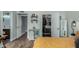 Bedroom with an open closet, yellow sheets, wood floor, next to the bathroom and cabinet with decorations at 1551 E Longhorn Dr, Chandler, AZ 85286