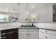 A closer look at the kitchen sink and countertop with the white subway tile backsplash at 1551 E Longhorn Dr, Chandler, AZ 85286