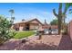 Inviting backyard features lush turf, desert landscaping, a pool, and cozy outdoor living area at 17424 N 1St Ave, Phoenix, AZ 85023