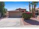 Attractive single-story home with a lush bougainvillea bush in the front yard and well-maintained landscaping at 17424 N 1St Ave, Phoenix, AZ 85023