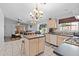 Bright kitchen with an island, light wood cabinets, stainless steel appliances, and tile flooring at 17424 N 1St Ave, Phoenix, AZ 85023