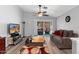 Inviting living room with vaulted ceilings, ceiling fan, slider doors and hardwood flooring at 17424 N 1St Ave, Phoenix, AZ 85023