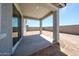 A beautiful covered patio featuring concrete flooring with recessed lighting and backyard access at 18219 W Daley Ln, Surprise, AZ 85387