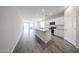 Modern kitchen with white cabinets, granite countertops, and stainless steel appliances at 18219 W Daley Ln, Surprise, AZ 85387