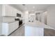 Modern kitchen with granite countertops, tile backsplash and stainless steel appliances at 18219 W Daley Ln, Surprise, AZ 85387