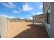 Large backyard with block fence, patio, and ample space for landscaping and recreation at 18236 W Daley Ln, Surprise, AZ 85387