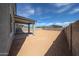 Backyard with covered patio, offering a private space for outdoor activities and relaxation at 18236 W Daley Ln, Surprise, AZ 85387