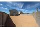 The large backyard is fully enclosed with block fencing, offering privacy and security for outdoor enjoyment at 18236 W Daley Ln, Surprise, AZ 85387