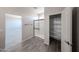 Bathroom with glass enclosed shower and tile flooring; walk-in closet at 18236 W Daley Ln, Surprise, AZ 85387