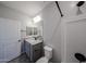 Well-lit bathroom with granite countertop vanity, stylish fixtures, and a shower-tub at 18236 W Daley Ln, Surprise, AZ 85387