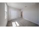 Clean bedroom with carpeted floors, bright window, and closet at 18236 W Daley Ln, Surprise, AZ 85387