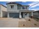 Charming two-story home featuring a spacious two-car garage and desert landscaping for low maintenance at 18236 W Daley Ln, Surprise, AZ 85387