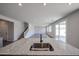 Kitchen island sink with granite counters and a view into the living space at 18236 W Daley Ln, Surprise, AZ 85387