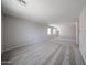 Bright and spacious loft area featuring soft carpet and large windows providing natural light at 18236 W Daley Ln, Surprise, AZ 85387