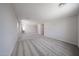 Expansive loft area featuring neutral walls, soft carpet, and offering flexible space for various activities at 18236 W Daley Ln, Surprise, AZ 85387