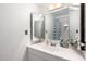 Bright bathroom featuring a vanity with a tri-fold mirror and a shower with blue patterned curtain at 2040 S Longmore -- # 9, Mesa, AZ 85202