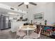 Dining area with a white table, pink chairs, and a view into the kitchen at 2040 S Longmore -- # 9, Mesa, AZ 85202