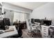 Home office with two desks, dual monitors, shelving, and a comfortable rolling chair at 2040 S Longmore -- # 9, Mesa, AZ 85202