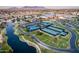 Aerial view of community tennis courts, lakes, and lush landscaping at 21093 N Willow Rd, Maricopa, AZ 85138