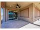 Spacious covered patio featuring a ceiling fan and tile flooring at 21093 N Willow Rd, Maricopa, AZ 85138