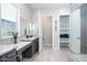 Well-lit bathroom featuring a vanity, granite countertops, toilet room, and shelving at 21093 N Willow Rd, Maricopa, AZ 85138