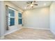 Spacious bedroom with wood-look flooring and ample natural light at 21093 N Willow Rd, Maricopa, AZ 85138