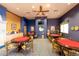 A card room with tables, comfortable chairs, and warm lighting perfect for friendly gatherings at 21093 N Willow Rd, Maricopa, AZ 85138