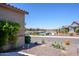 Scenic view of the community pond, landscaping, and surrounding homes at 21093 N Willow Rd, Maricopa, AZ 85138