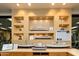 A display of model ships in glass cases with detailed descriptions, adding a nautical touch at 21093 N Willow Rd, Maricopa, AZ 85138