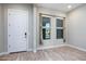 Bright entryway showcasing the wood-look flooring and natural light at 21093 N Willow Rd, Maricopa, AZ 85138