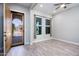 Inviting entryway with natural light from windows and stylish front door at 21093 N Willow Rd, Maricopa, AZ 85138