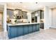 Modern kitchen featuring an island, stainless steel appliances, and stylish pendant lighting at 21093 N Willow Rd, Maricopa, AZ 85138