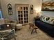 Cozy living room featuring a classic display cabinet and neutral decor at 21093 N Willow Rd, Maricopa, AZ 85138
