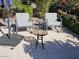 Comfortable patio seating area with umbrella to enjoy the cool outdoors at 21093 N Willow Rd, Maricopa, AZ 85138
