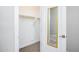 Carpeted walk-in closet with open door at 21093 N Willow Rd, Maricopa, AZ 85138