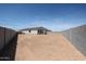 Expansive backyard with block fence, offering privacy and potential for customization at 22035 N Rummler Ln, Maricopa, AZ 85138