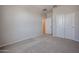 Bedroom featuring plush carpeting, neutral walls, and ample closet space at 22035 N Rummler Ln, Maricopa, AZ 85138