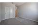 Spacious bedroom with plush carpeting and generous closet space at 22035 N Rummler Ln, Maricopa, AZ 85138