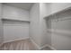 Walk-in closet interior with installed rods for maximum organization at 22035 N Rummler Ln, Maricopa, AZ 85138