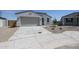 Charming single-story home featuring a two-car garage and well-maintained front yard at 22035 N Rummler Ln, Maricopa, AZ 85138