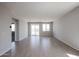 Spacious living room with tiled floors, sliding glass doors to the backyard, and plenty of natural light at 22035 N Rummler Ln, Maricopa, AZ 85138
