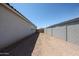 Narrow, empty side yard and CMU block fence at 22035 N Rummler Ln, Maricopa, AZ 85138