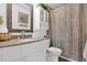 Bathroom with a vanity, framed mirror, toilet, and a shower with a neutral colored shower curtain at 2219 E Catalina Dr, Phoenix, AZ 85016