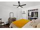 Bright bedroom featuring a ceiling fan, walk-in closet, and a neutral color palette at 2219 E Catalina Dr, Phoenix, AZ 85016