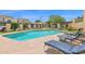 Community pool with lounge chairs for residents to relax and enjoy the sunshine, adding to the community appeal at 2219 E Catalina Dr, Phoenix, AZ 85016