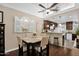 Cozy dining area with stylish furnishings, a ceiling fan, and seamless flow to the modern kitchen at 2219 E Catalina Dr, Phoenix, AZ 85016