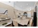 Light and airy dining room featuring a wooden table set with decor and views to a living area at 2219 E Catalina Dr, Phoenix, AZ 85016