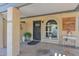 Inviting front porch with a decorative door and bright arched window adds charm to this lovely home at 2219 E Catalina Dr, Phoenix, AZ 85016